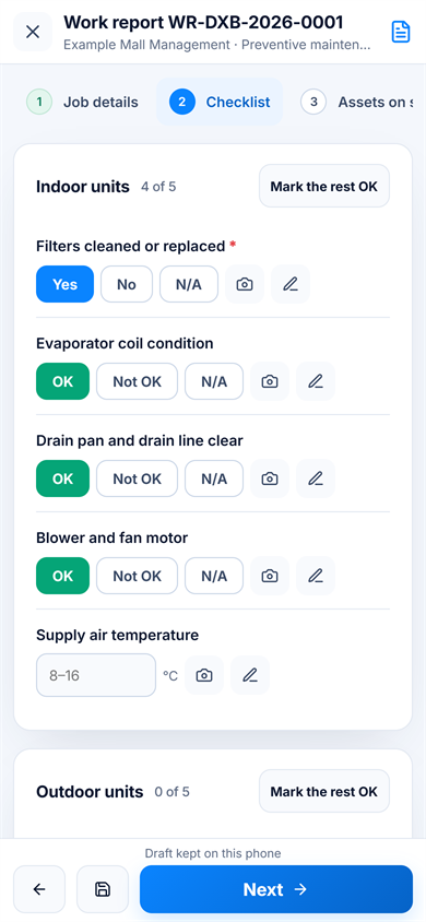 Technician completing a service checklist