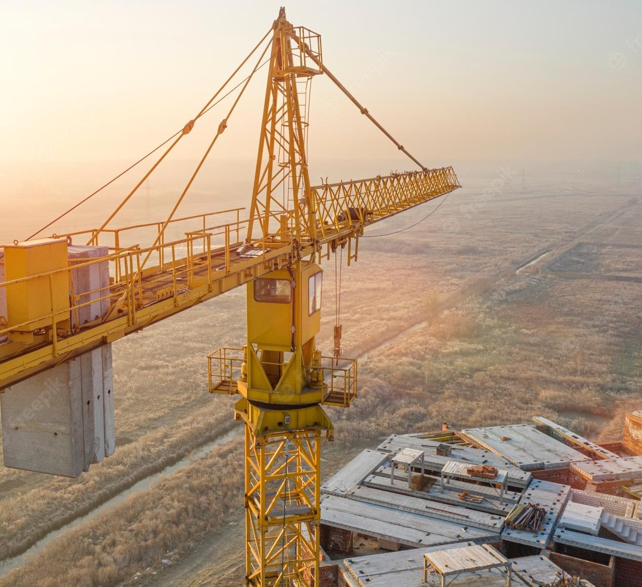 Aerial view of construction crane on a steel structure site